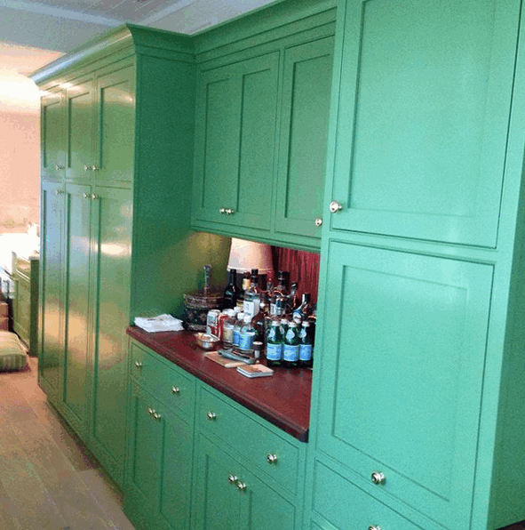 Beautiful custom cabinets with mahogany top and oak floors