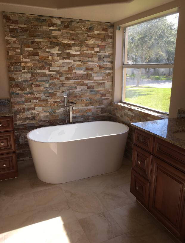 Bathroom custom stone wall with free standing tub