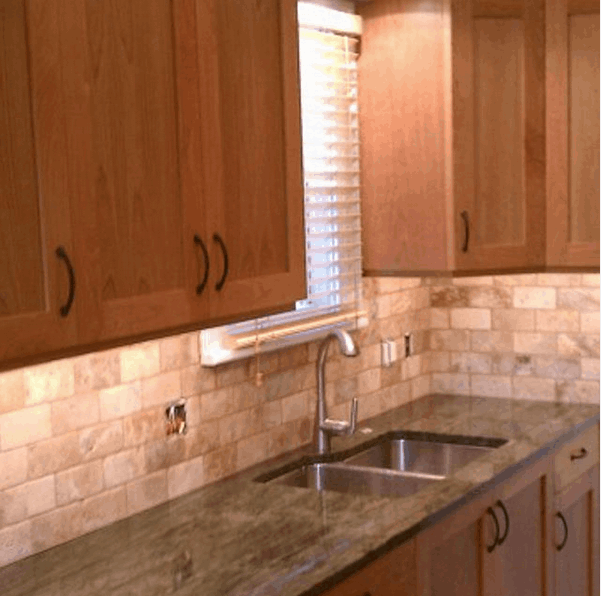 Kitchen remodeling with travertine backsplash