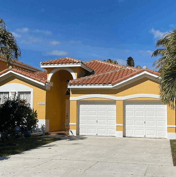 Pressure cleaned roof driveway and exterior painting